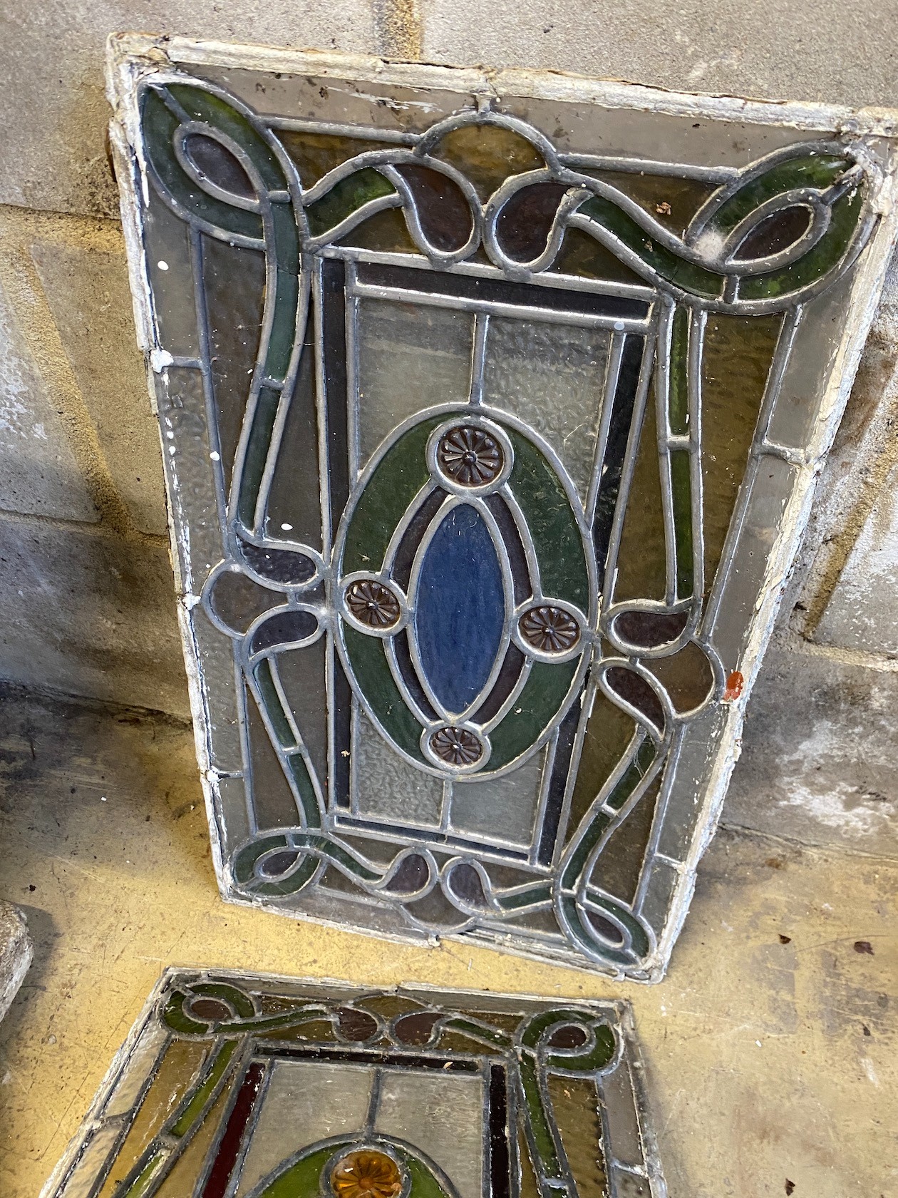 Four rectangular stained glass panels, each width 33cm, height 53cm